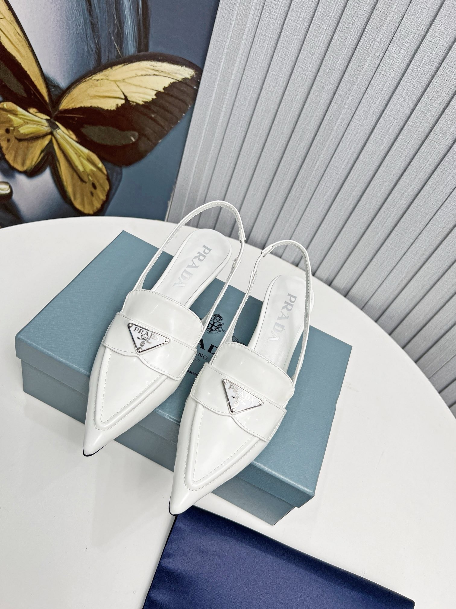 Pra*a slingback pumps 45mm in white patent calfskin