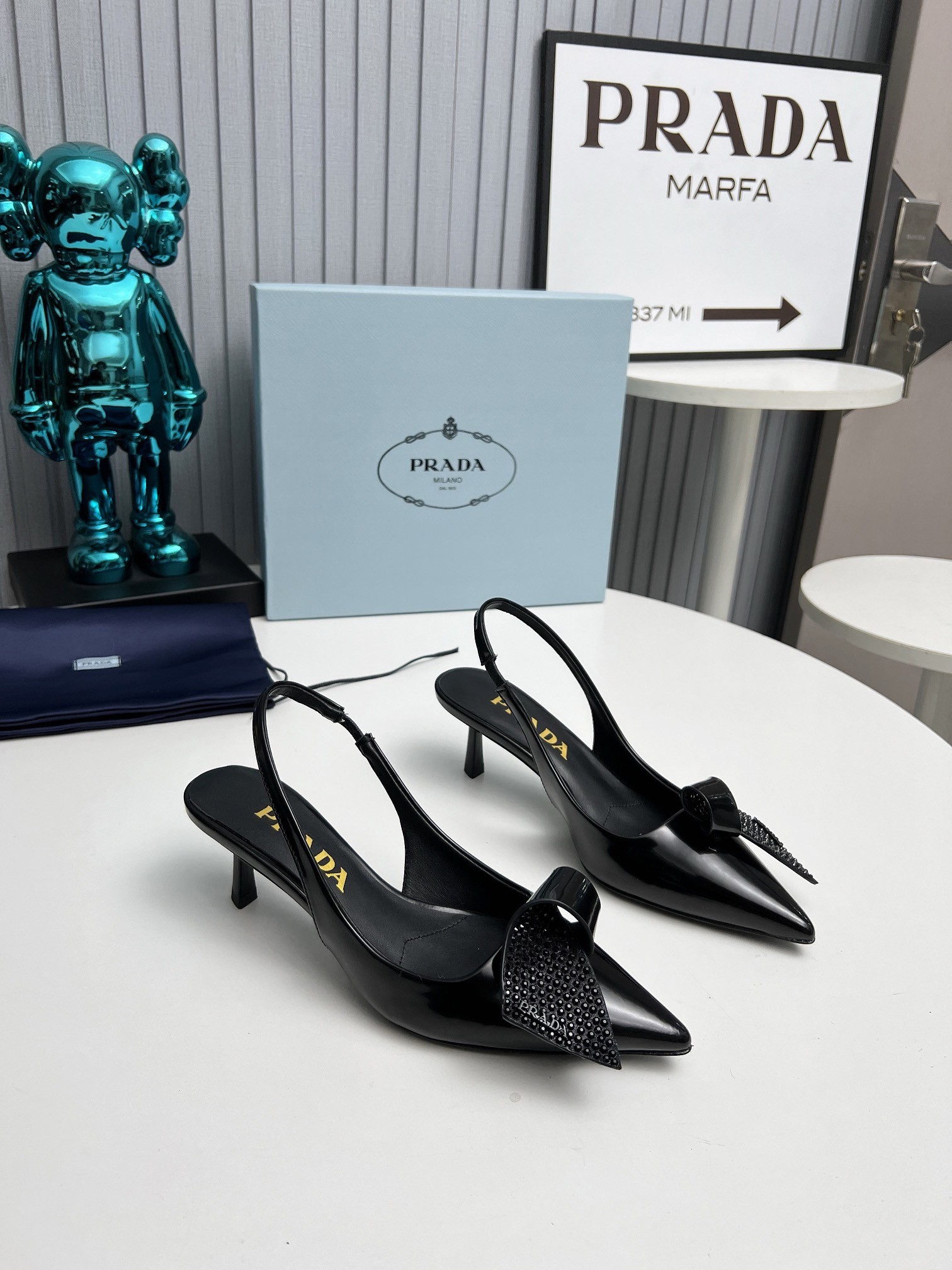 Pra*a slingback pumps 55mm in black patent with crystals ornament