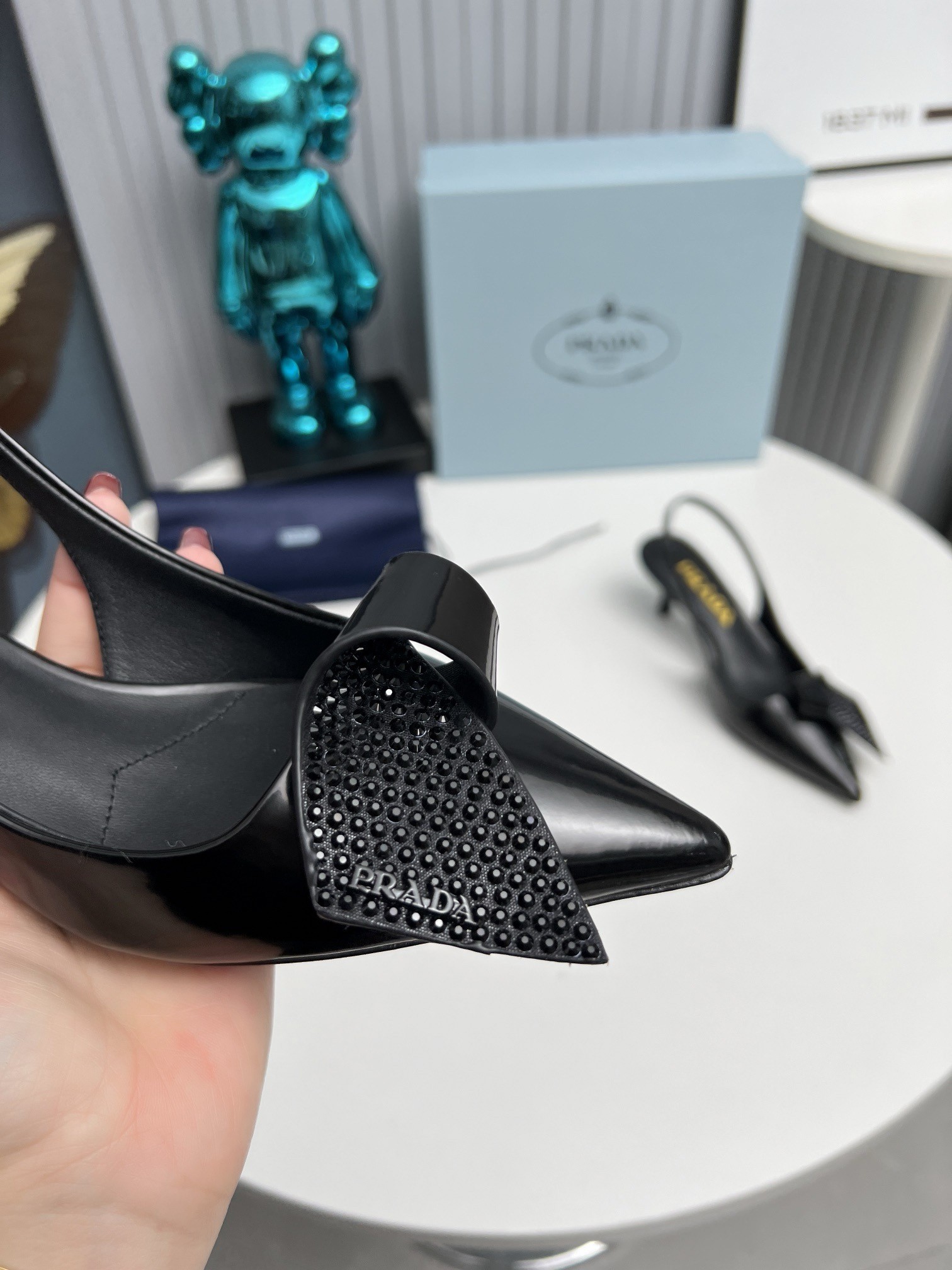 Pra*a slingback pumps 55mm in black patent with crystals ornament