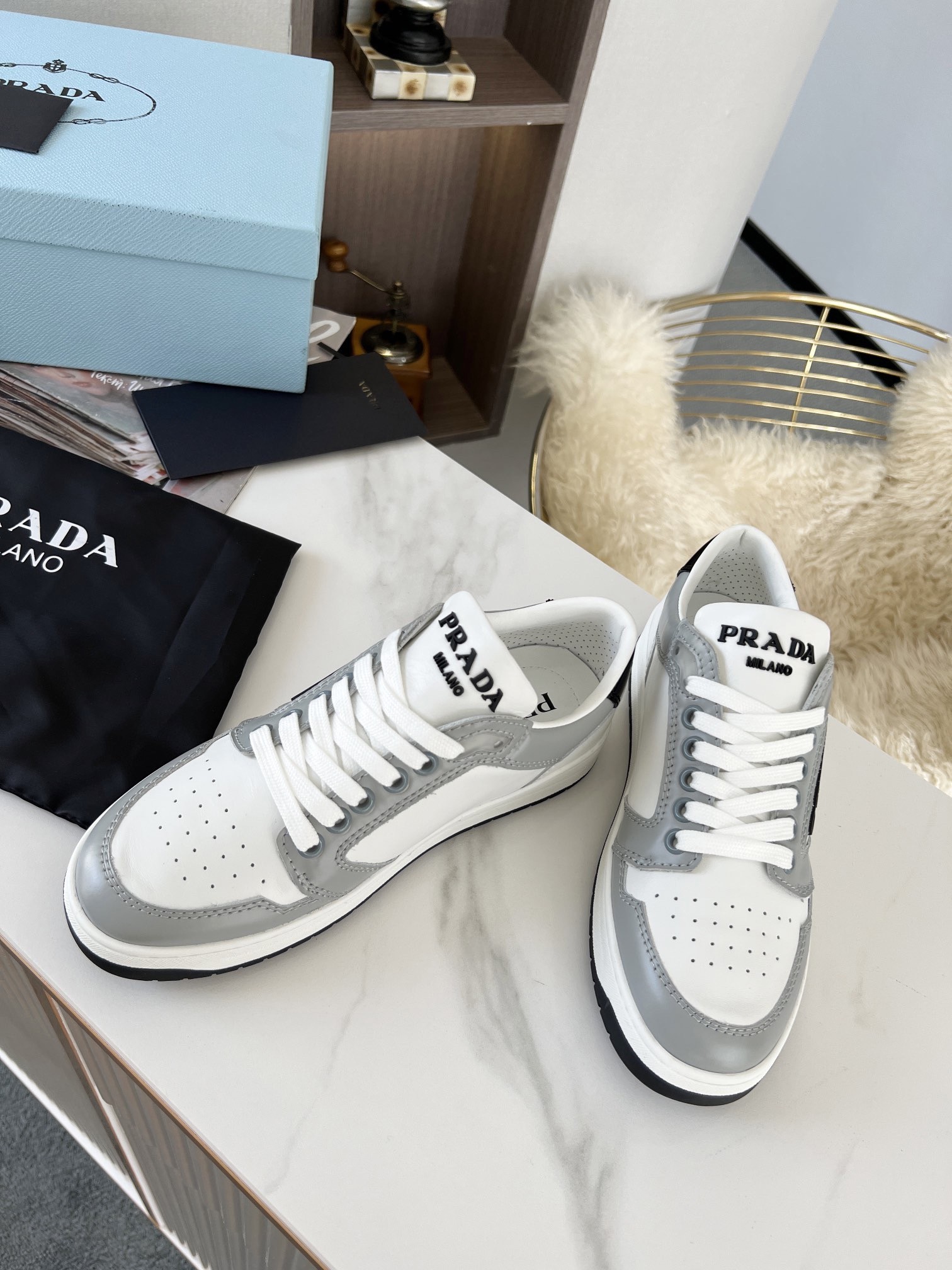 Pra*a district sneakers in white and grey calfskin