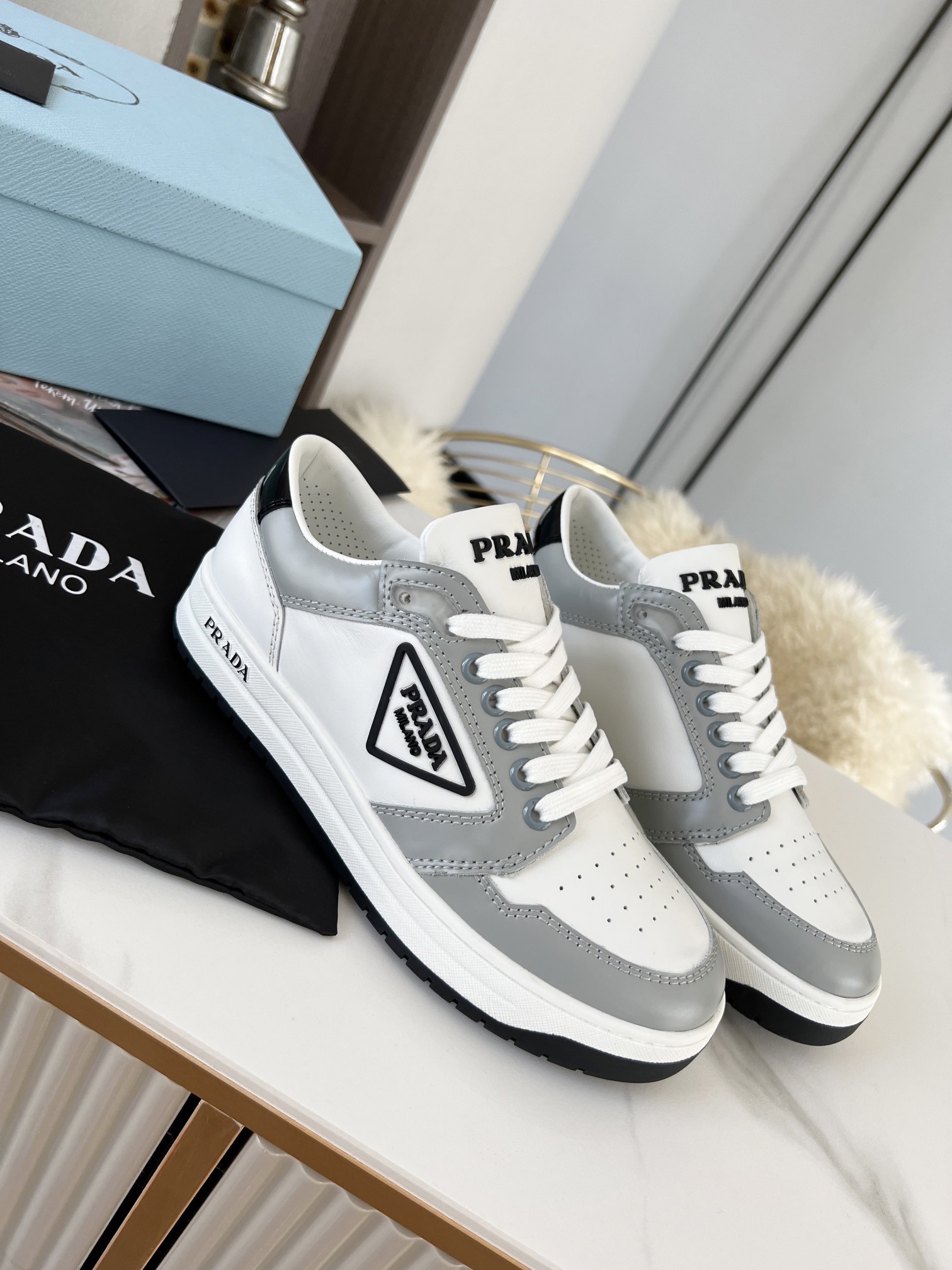 Pra*a district sneakers in white and grey calfskin
