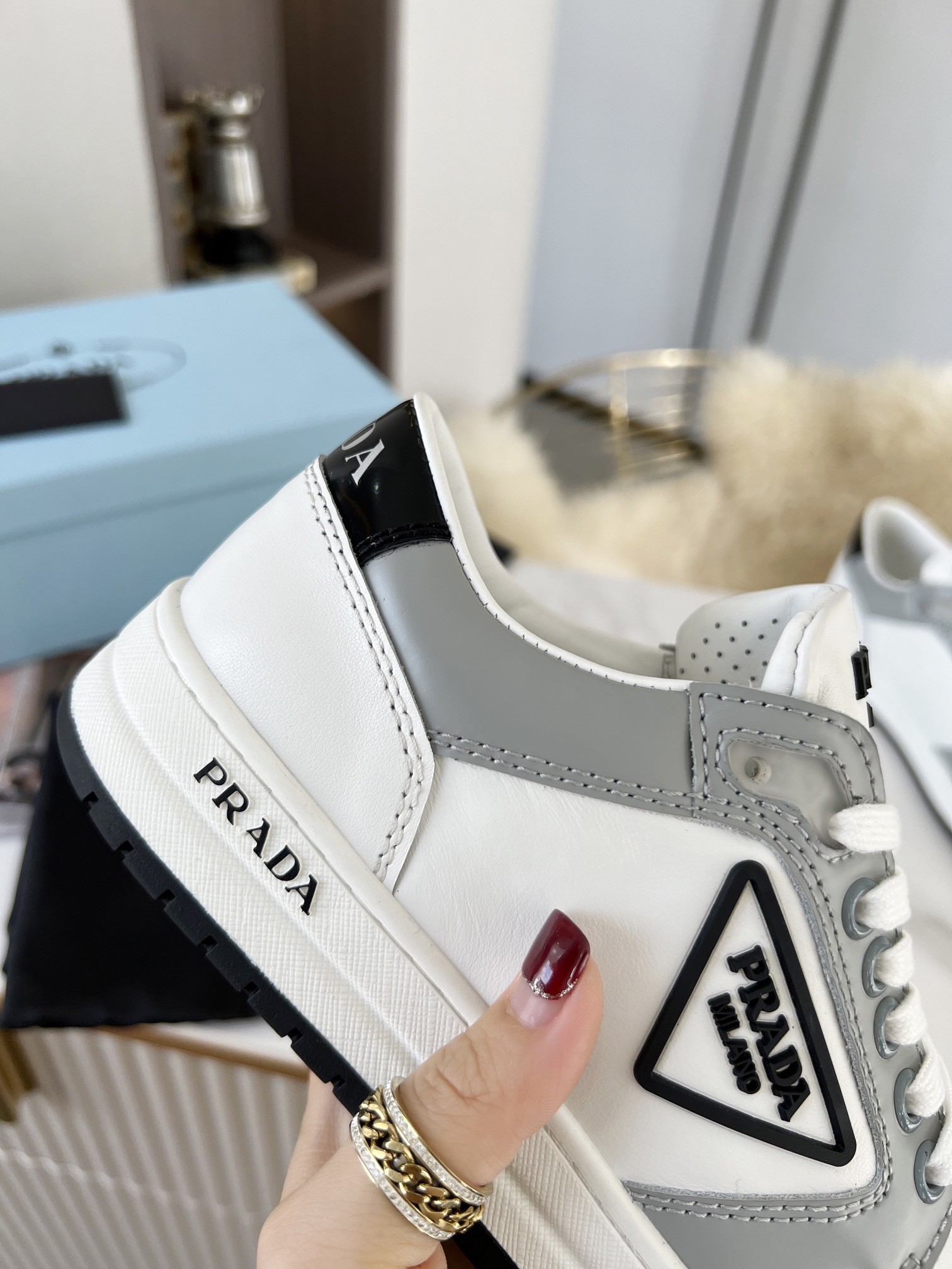 Pra*a district sneakers in white and grey calfskin