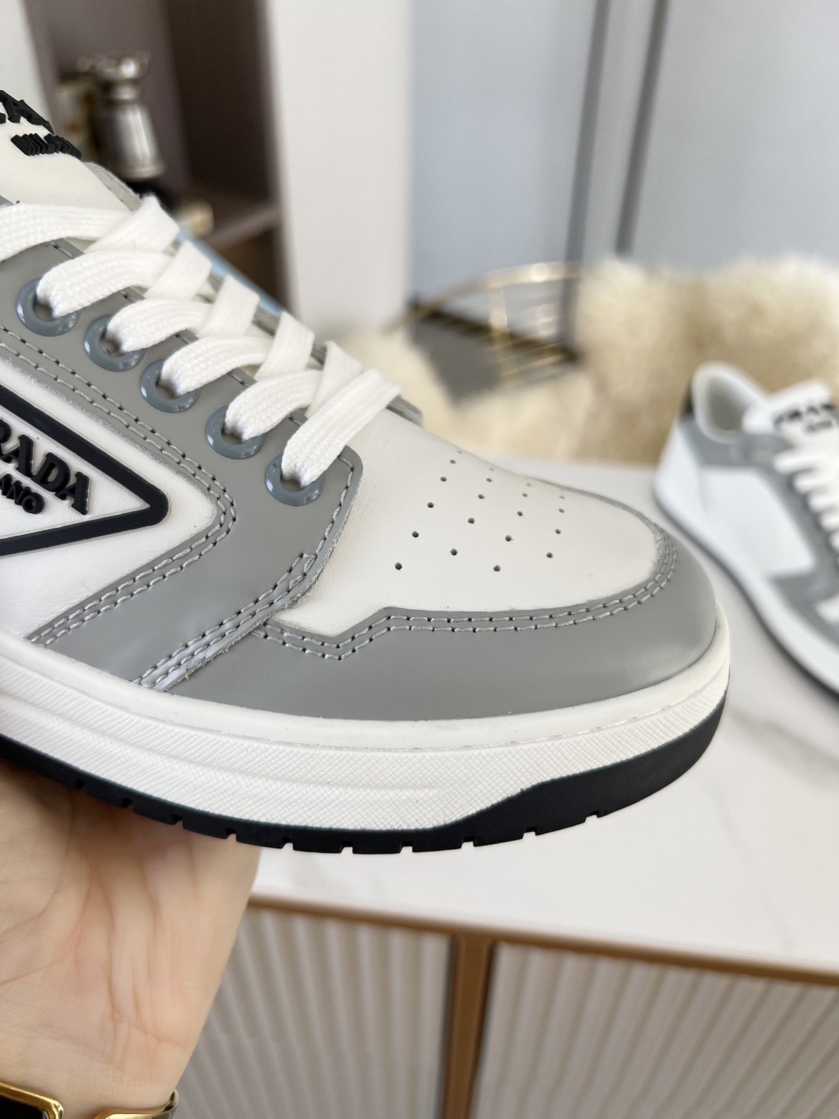 Pra*a district sneakers in white and grey calfskin