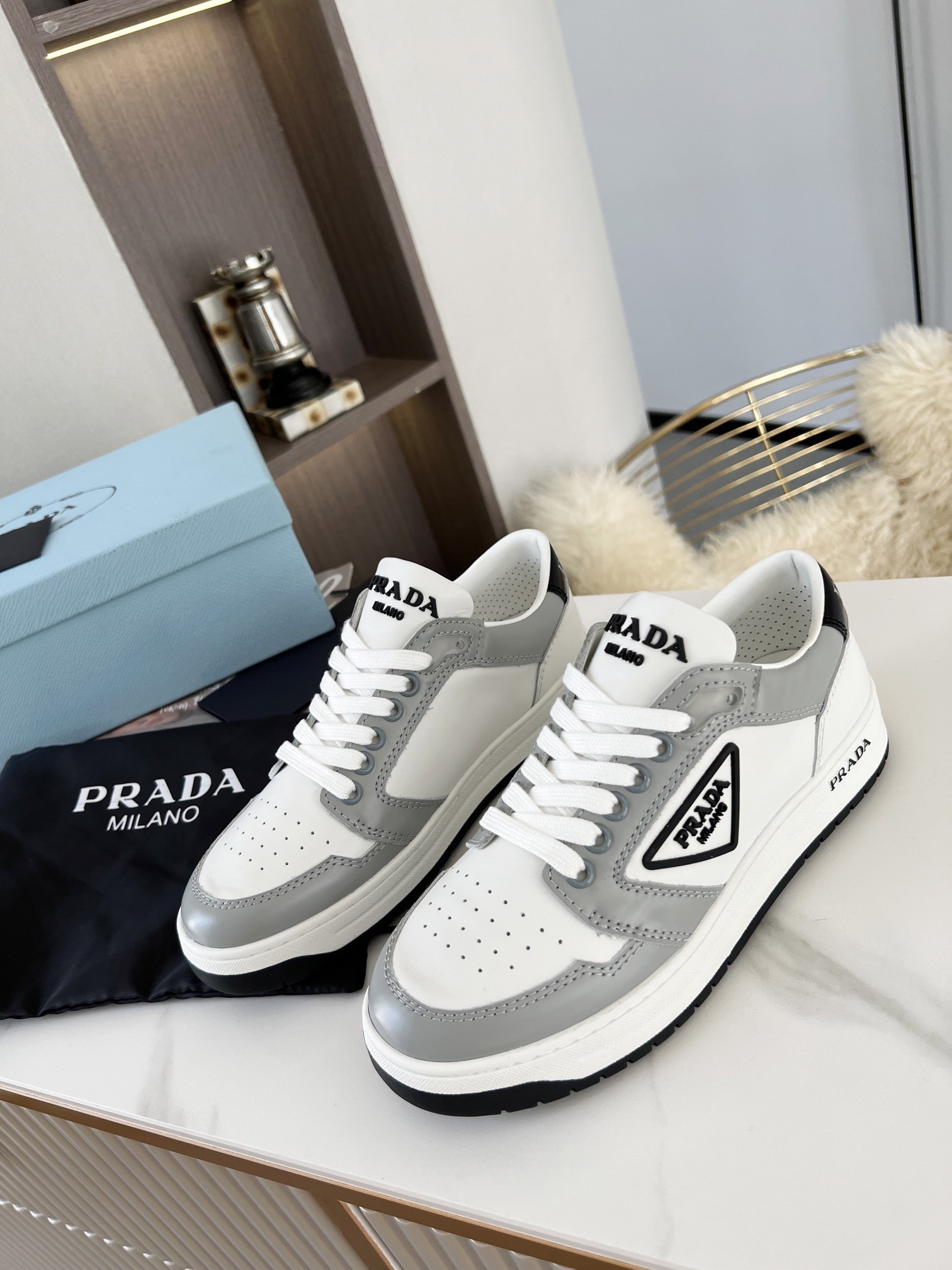 Pra*a district sneakers in white and grey calfskin