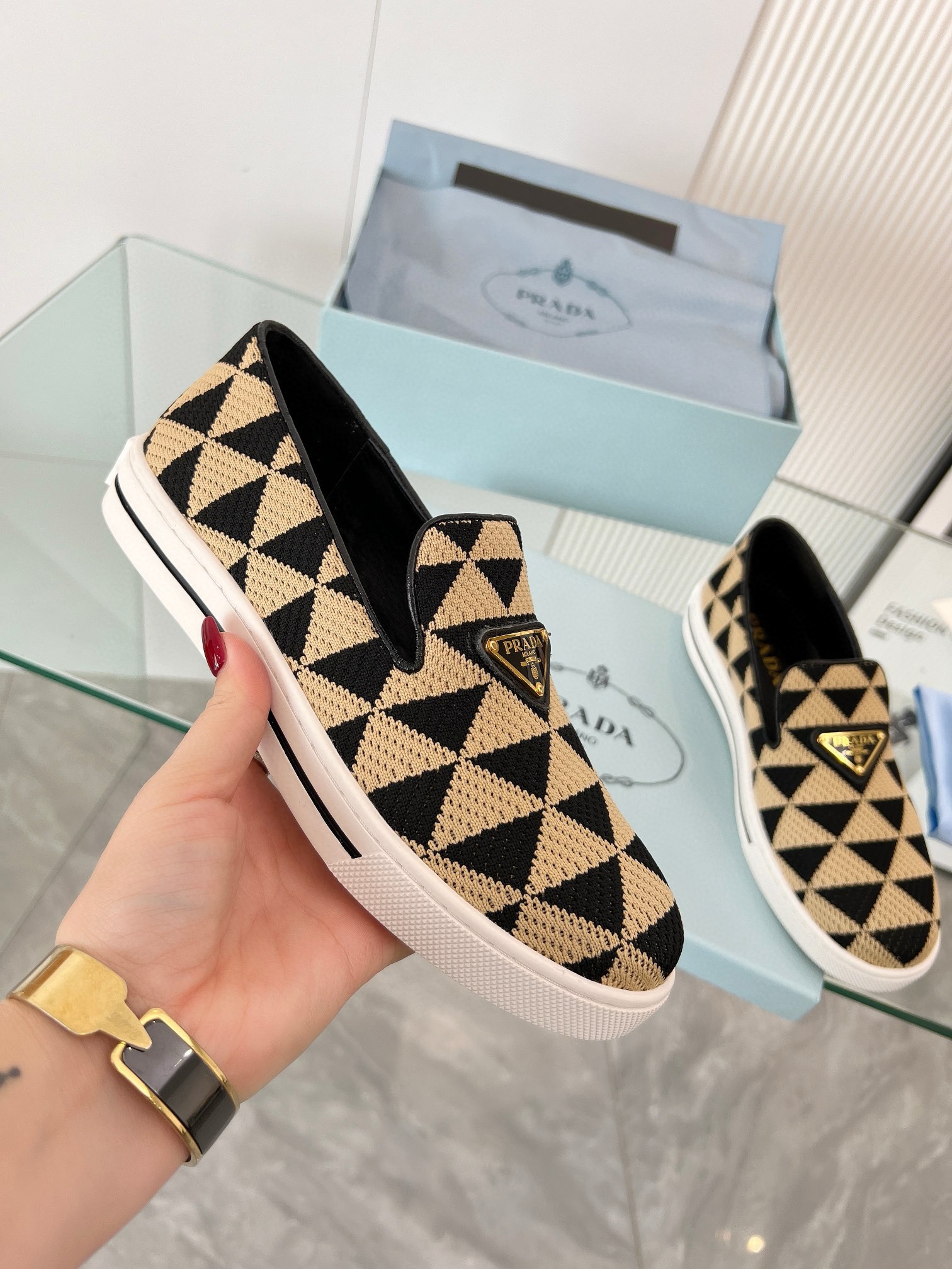 Pra*a slip-on sneakers in black/beige embroidered fabric