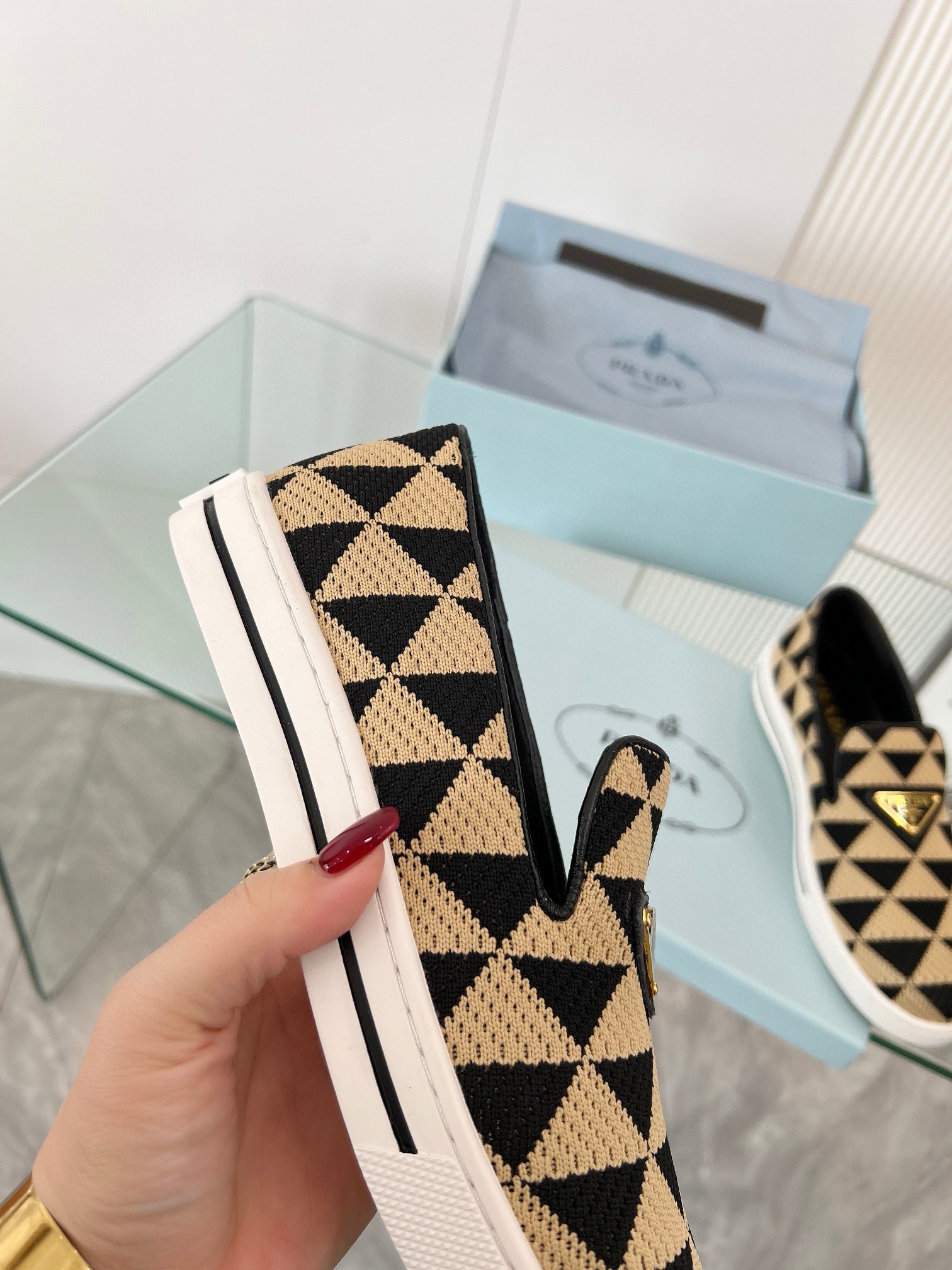 Pra*a slip-on sneakers in black/beige embroidered fabric