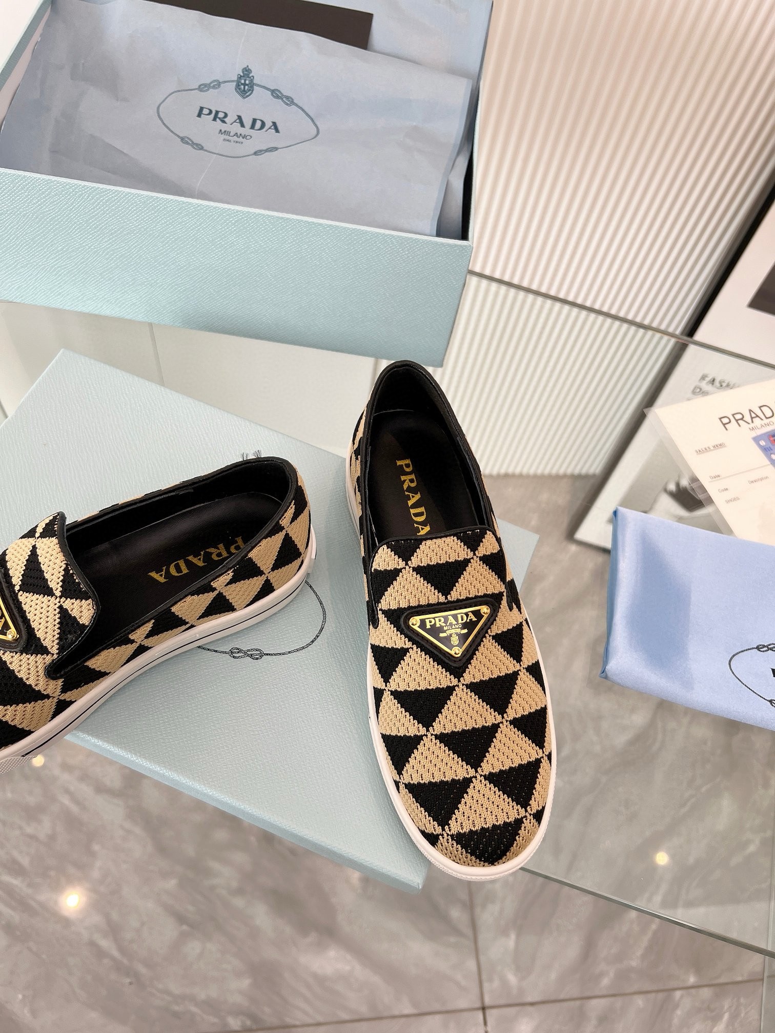 Pra*a slip-on sneakers in black/beige embroidered fabric