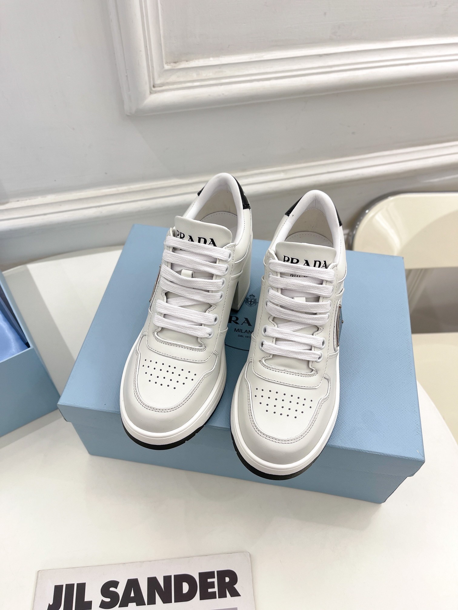 Pra*a downtown high-heeled sneakers in white leather