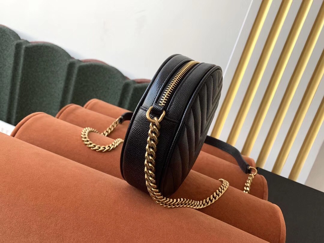 Sa**t Lau*nt vinyle round camera bag in black grained leather