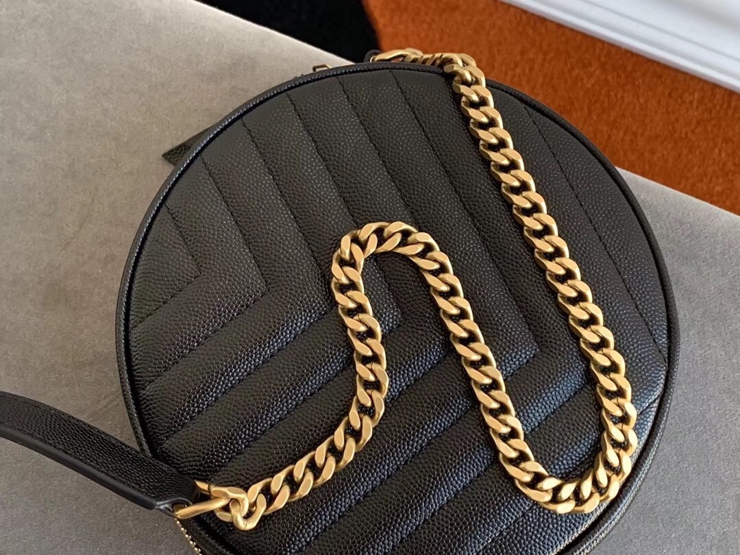 Sa**t Lau*nt vinyle round camera bag in black grained leather