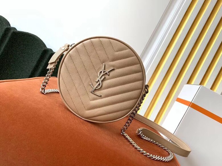 Sa**t Lau*nt vinyle round camera bag in beige grained leather