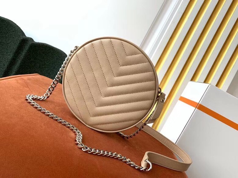 Sa**t Lau*nt vinyle round camera bag in beige grained leather
