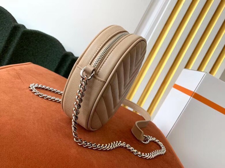 Sa**t Lau*nt vinyle round camera bag in beige grained leather
