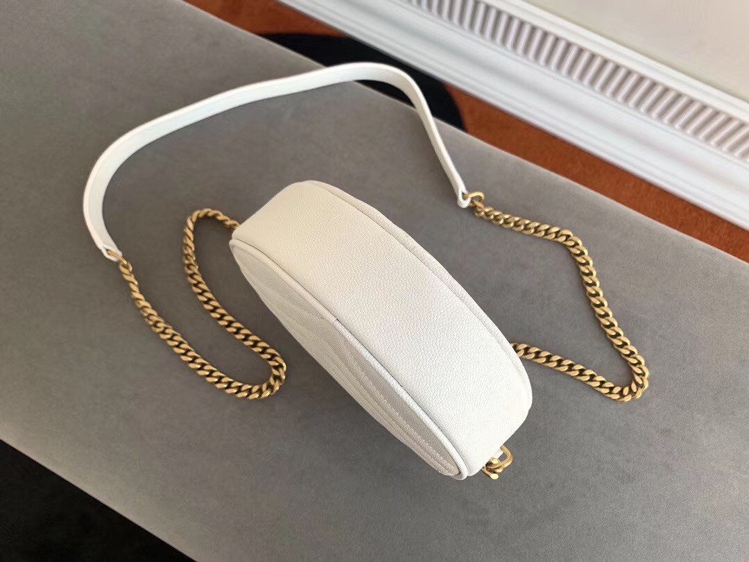 Sa**t Lau*nt vinyle round camera bag in white grained leather