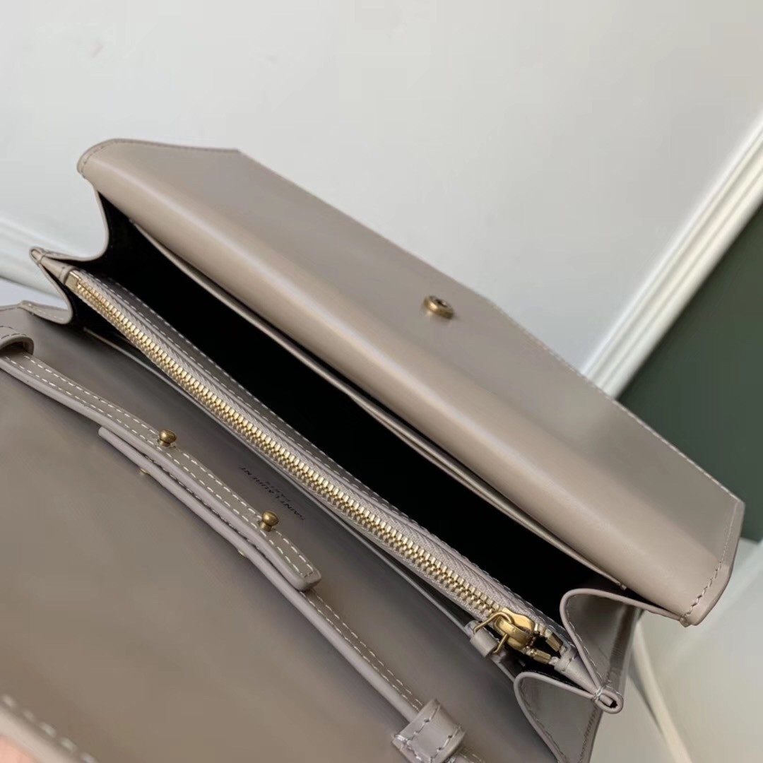 Sa**t Lau*nt woc sulpice chain wallet in beige calfskin