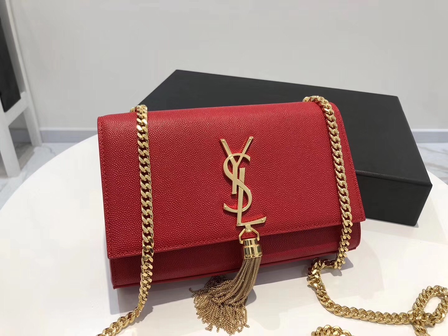 Sa**t Lau*nt small kate tassel bag in red grained leather