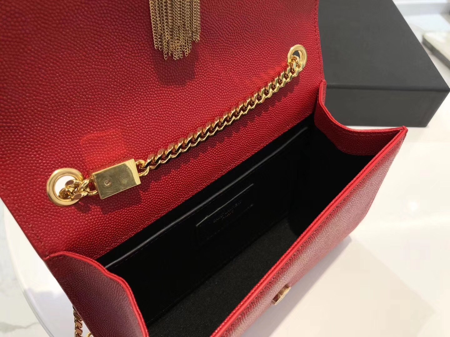 Sa**t Lau*nt small kate tassel bag in red grained leather