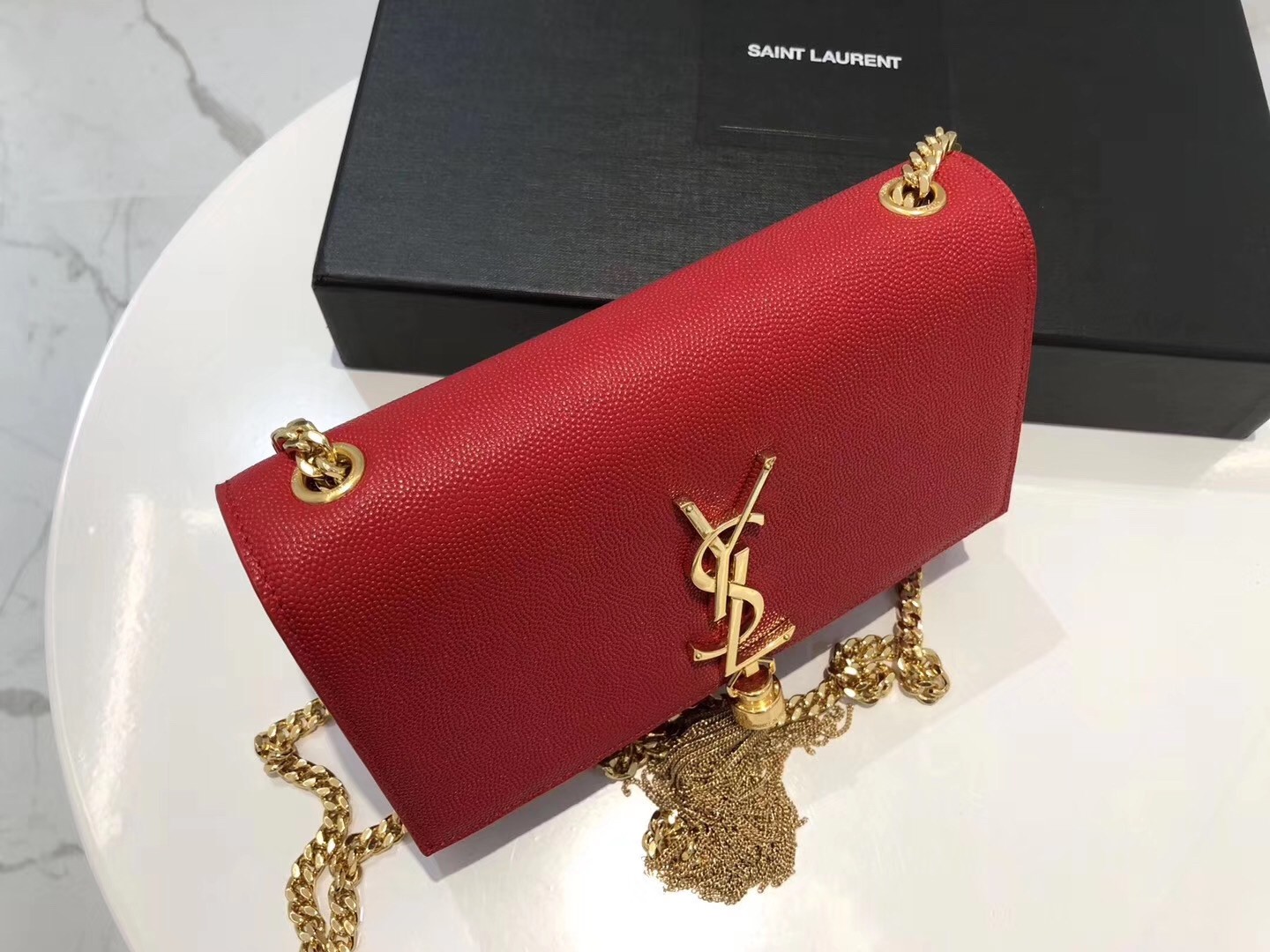 Sa**t Lau*nt small kate tassel bag in red grained leather