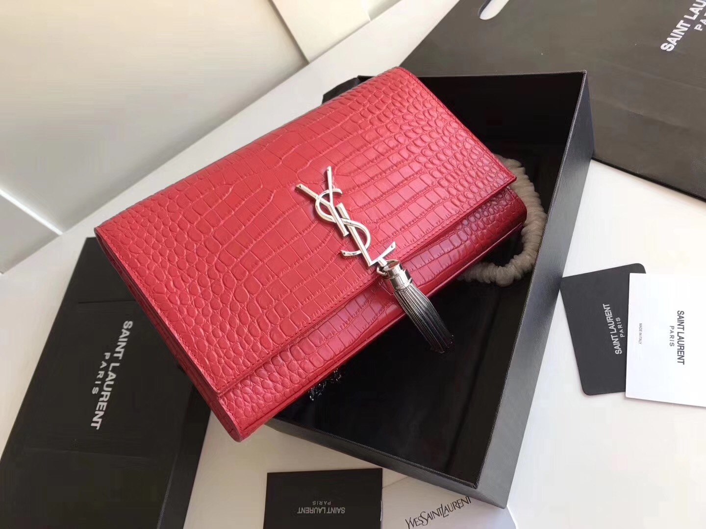 Sa**t Lau*nt medium kate bag with tassel in red croc-embossed leather