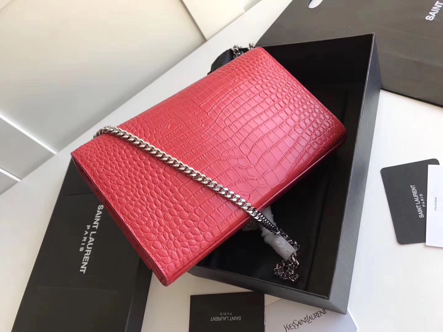 Sa**t Lau*nt medium kate bag with tassel in red croc-embossed leather