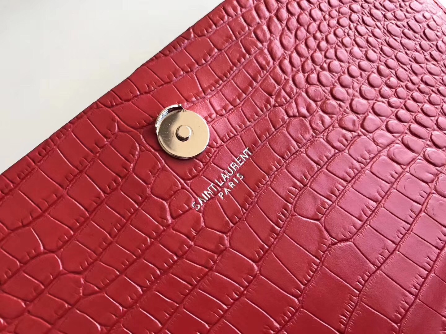 Sa**t Lau*nt medium kate bag with tassel in red croc-embossed leather