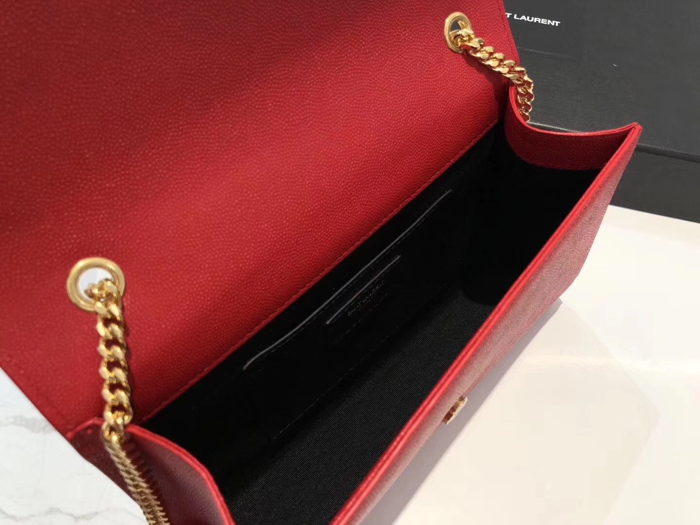 Sa**t Lau*nt medium kate bag with tassel in red grained leather