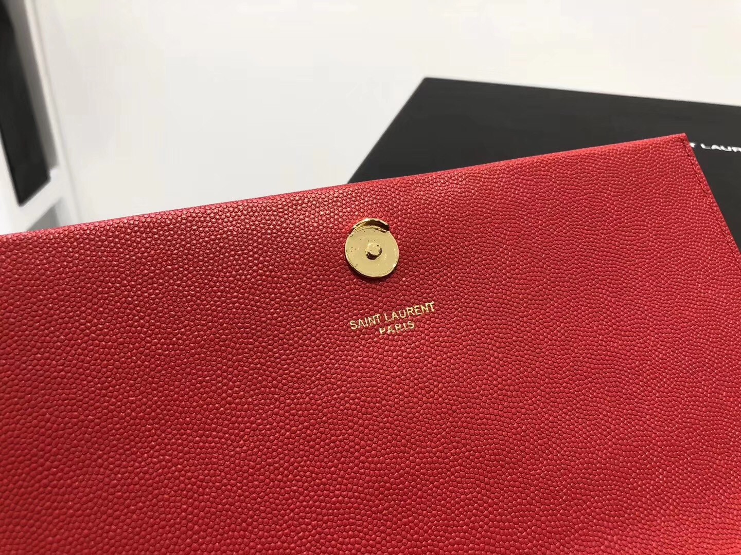 Sa**t Lau*nt medium kate bag with tassel in red grained leather
