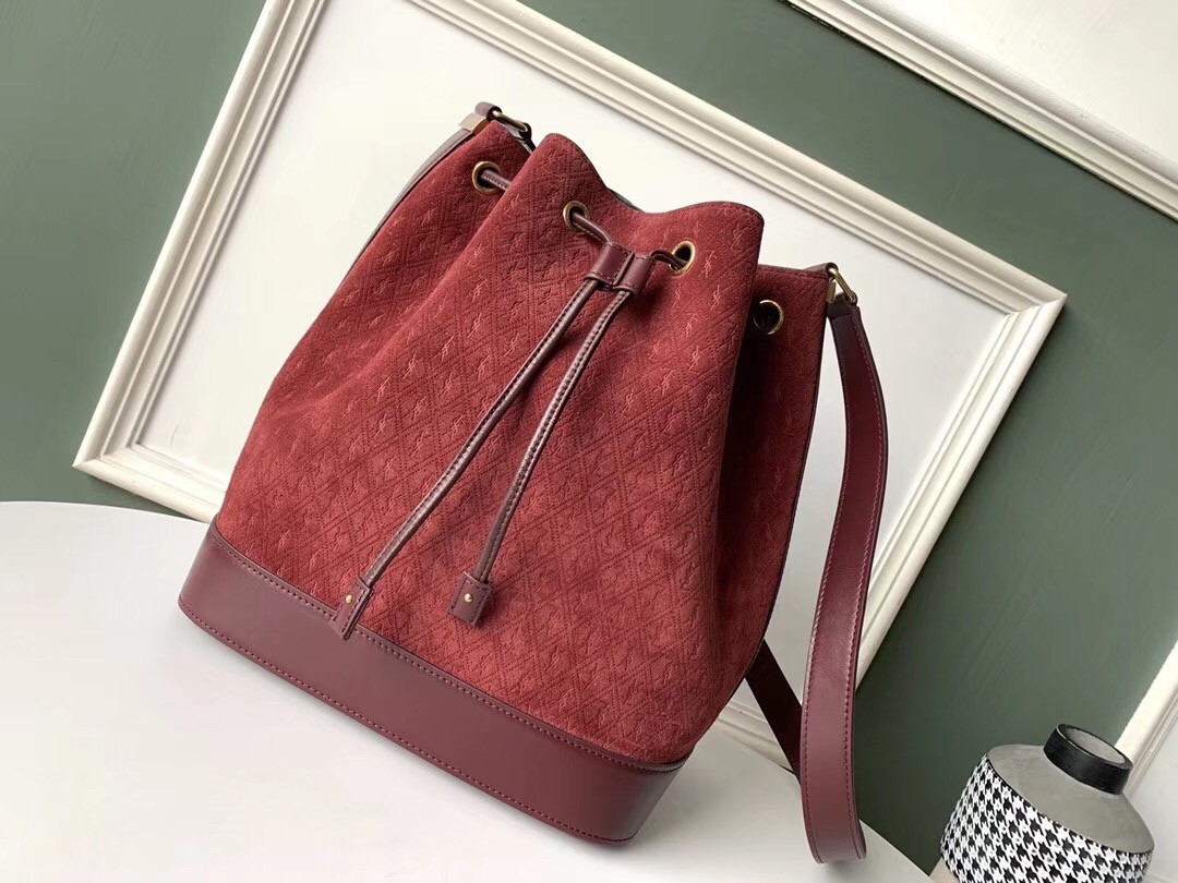 Sa**t Lau*nt monogram all over bucket bag in bordeaux suede