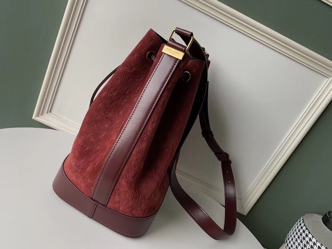Sa**t Lau*nt monogram all over bucket bag in bordeaux suede