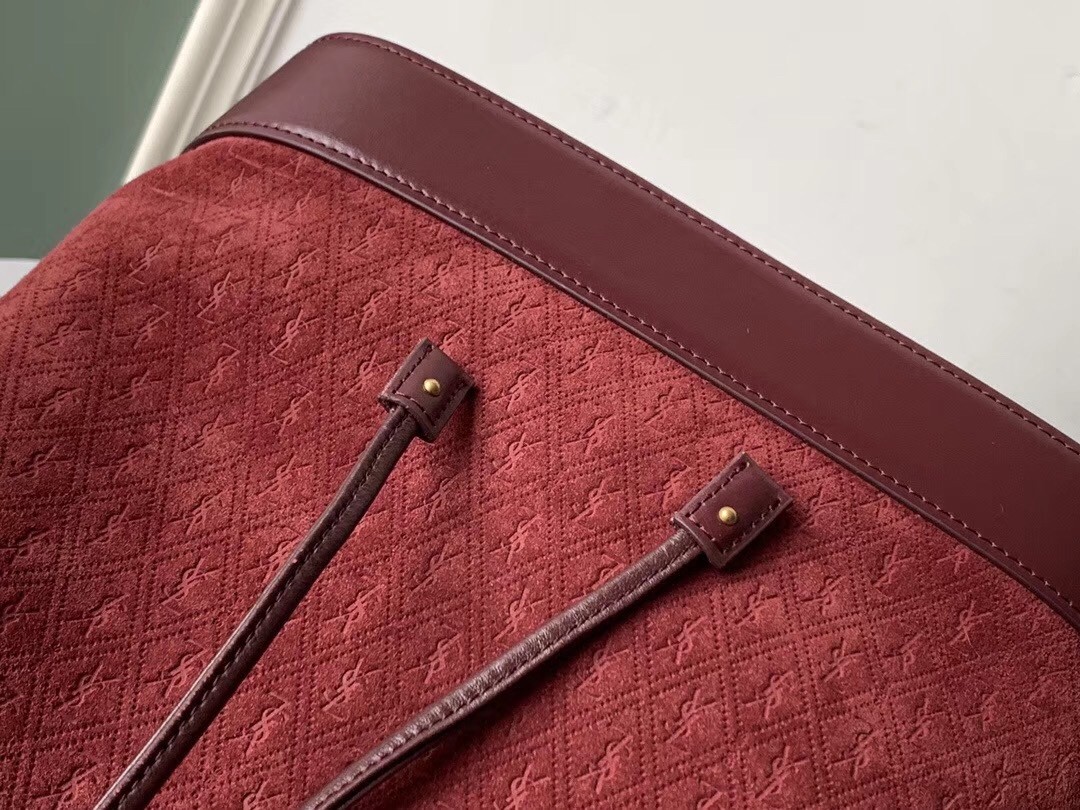 Sa**t Lau*nt monogram all over bucket bag in bordeaux suede