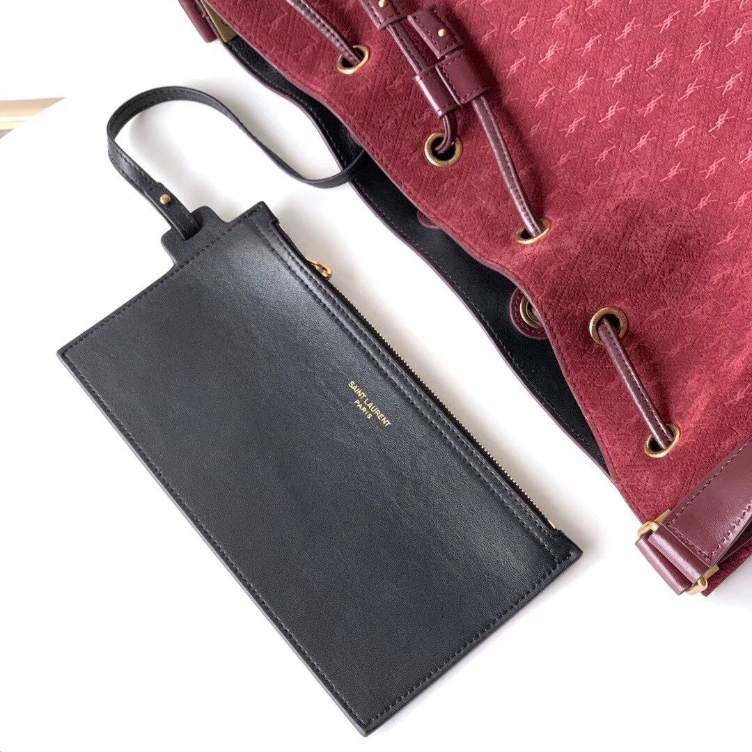 Sa**t Lau*nt monogram all over bucket bag in bordeaux suede