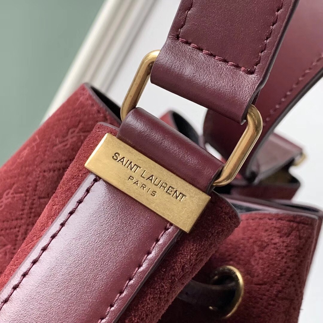 Sa**t Lau*nt monogram all over bucket bag in bordeaux suede