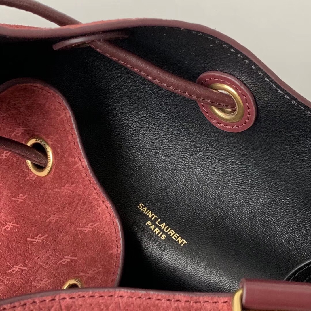 Sa**t Lau*nt monogram all over bucket bag in bordeaux suede