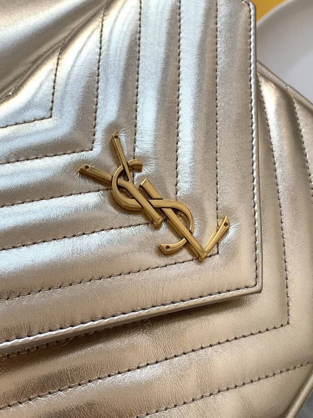 Sa**t Lau*nt joe backpack in gold lame leather