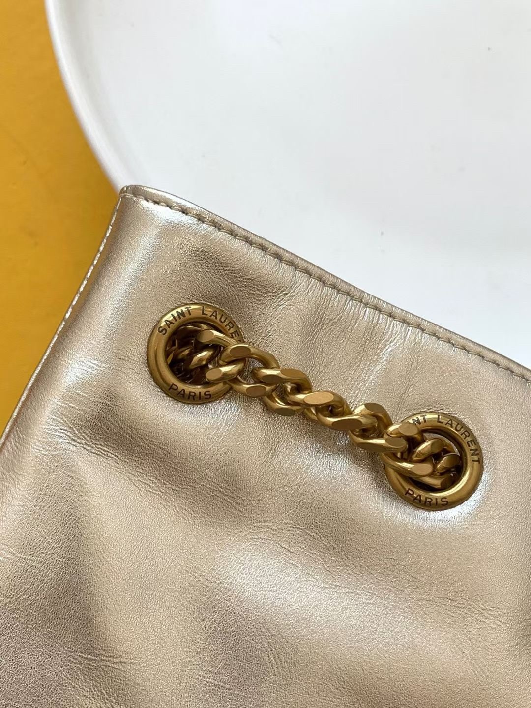 Sa**t Lau*nt joe backpack in gold lame leather