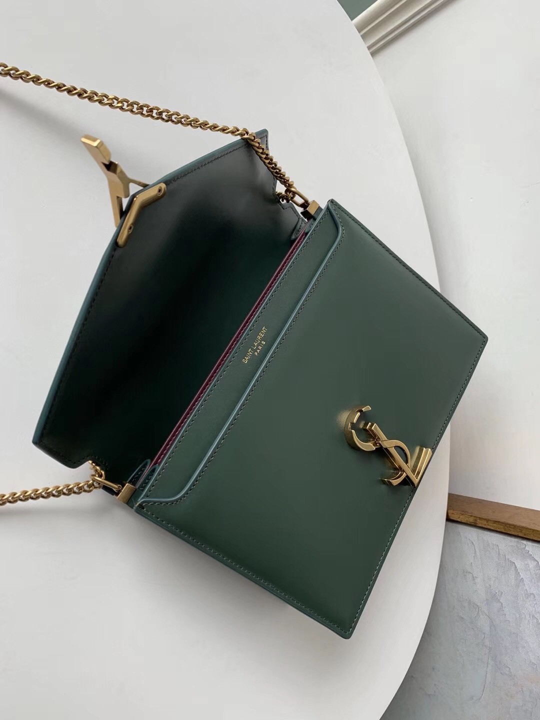 Sa**t Lau*nt dark green cassandra monogram clasp bag