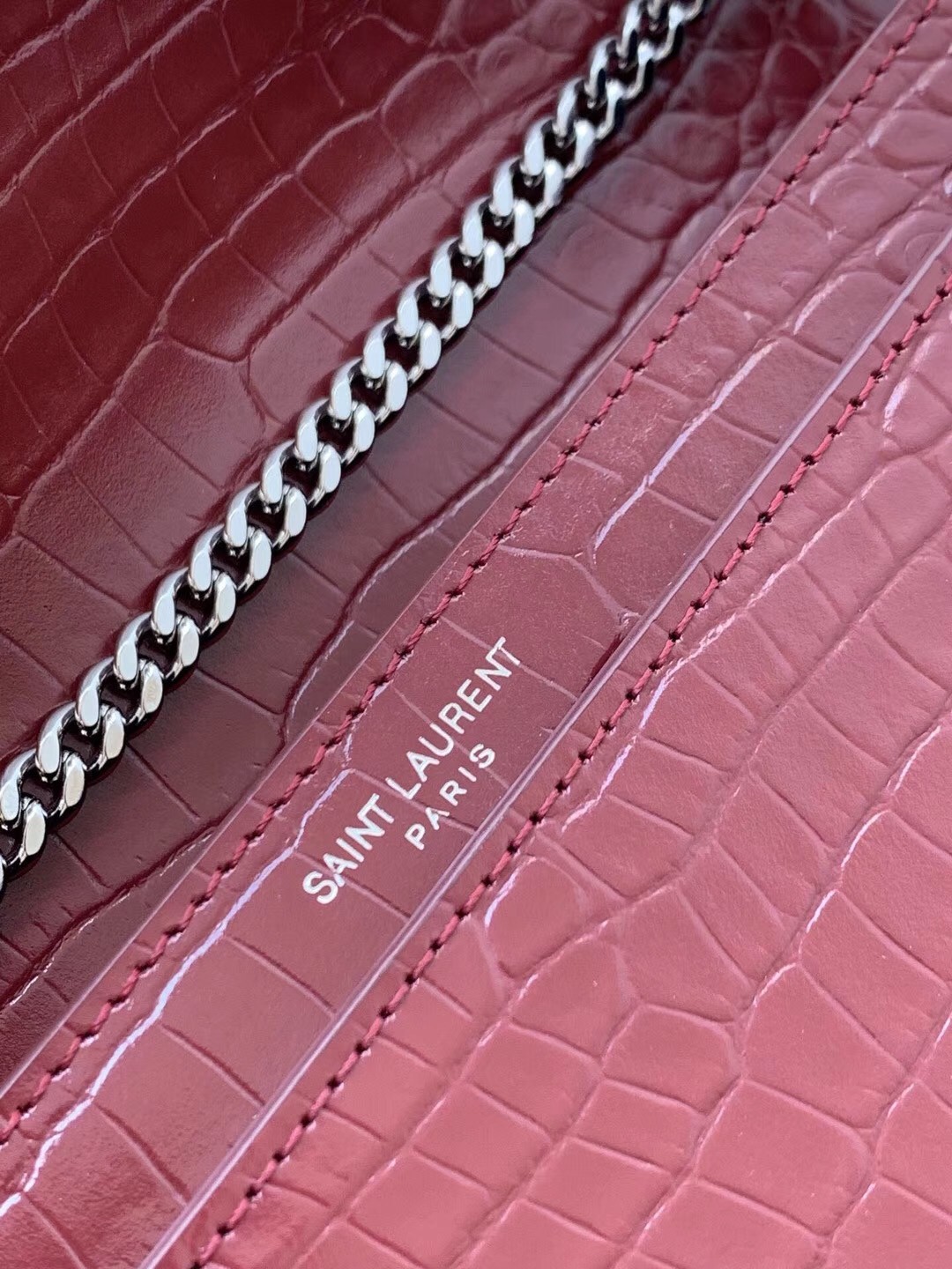 Sa**t Lau*nt cassandra clasp bag in bordeaux croc-embossed leather