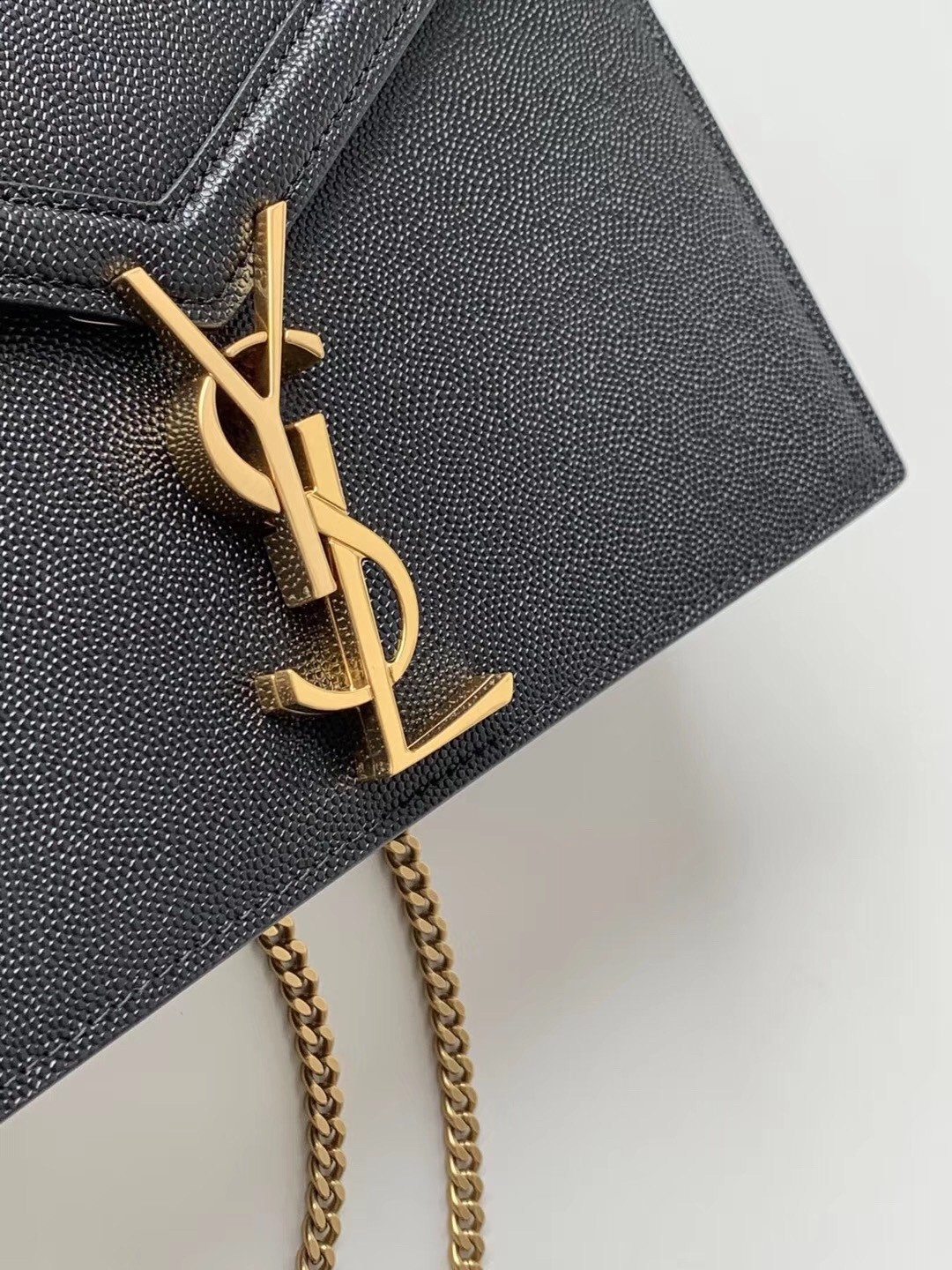 Sa**t Lau*nt cassandra clasp bag in black grained leather