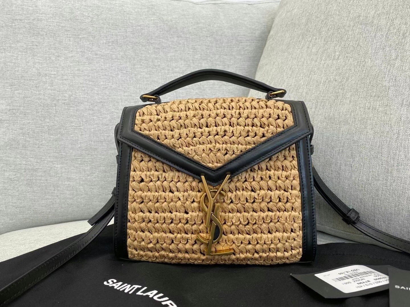 Sa**t Lau*nt cassandra mini top handle bag in raffia