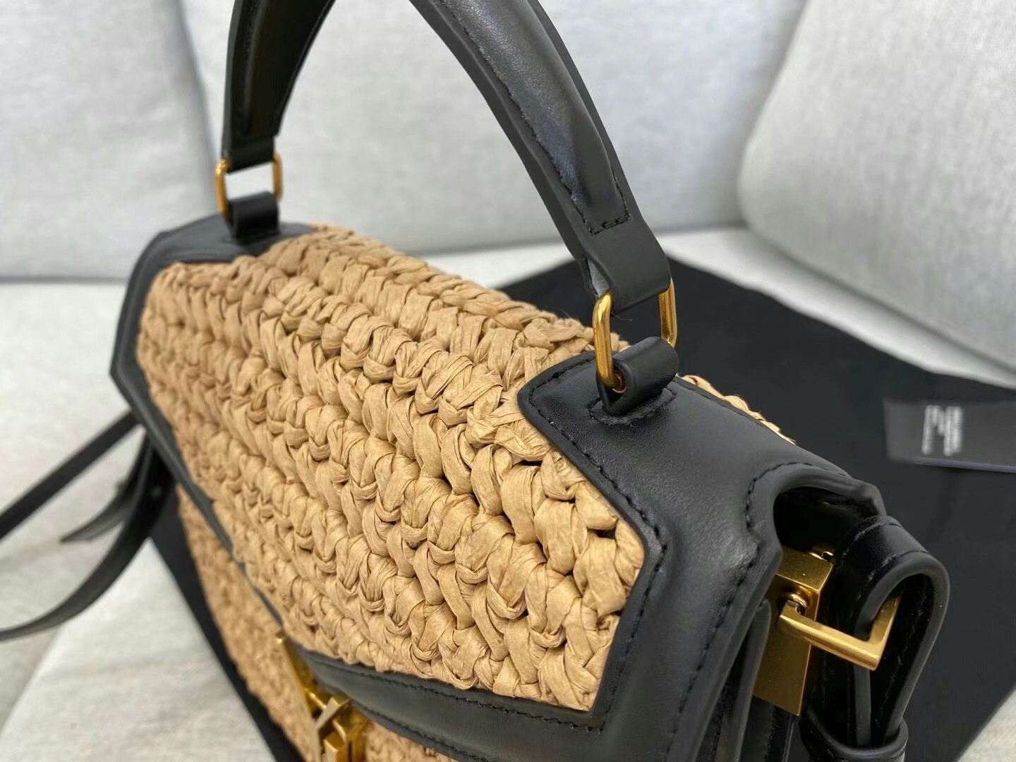 Sa**t Lau*nt cassandra mini top handle bag in raffia