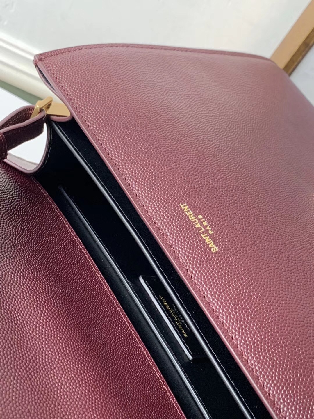 Sa**t Lau*nt cassandra medium bag in bordeaux grained leather