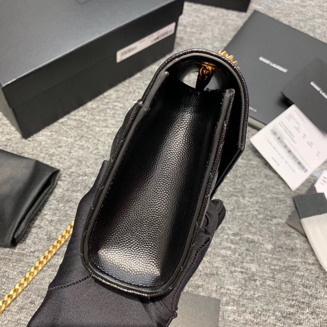Sa**t Lau*nt small envelope bag in black grained leather