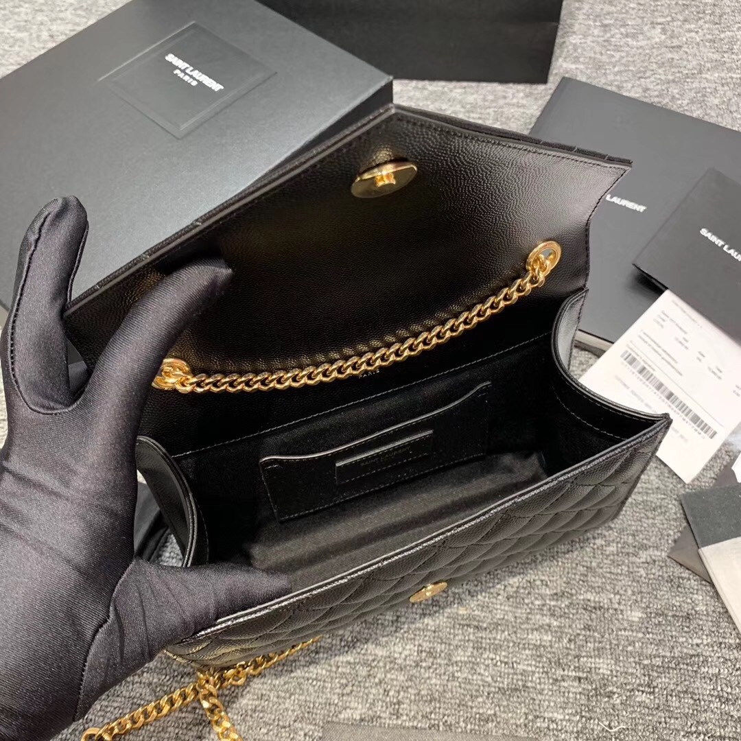 Sa**t Lau*nt small envelope bag in black grained leather