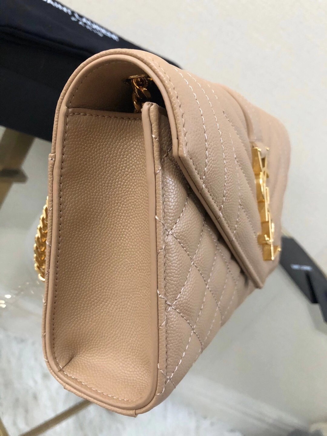 Sa**t Lau*nt small envelope bag in beige grained leather
