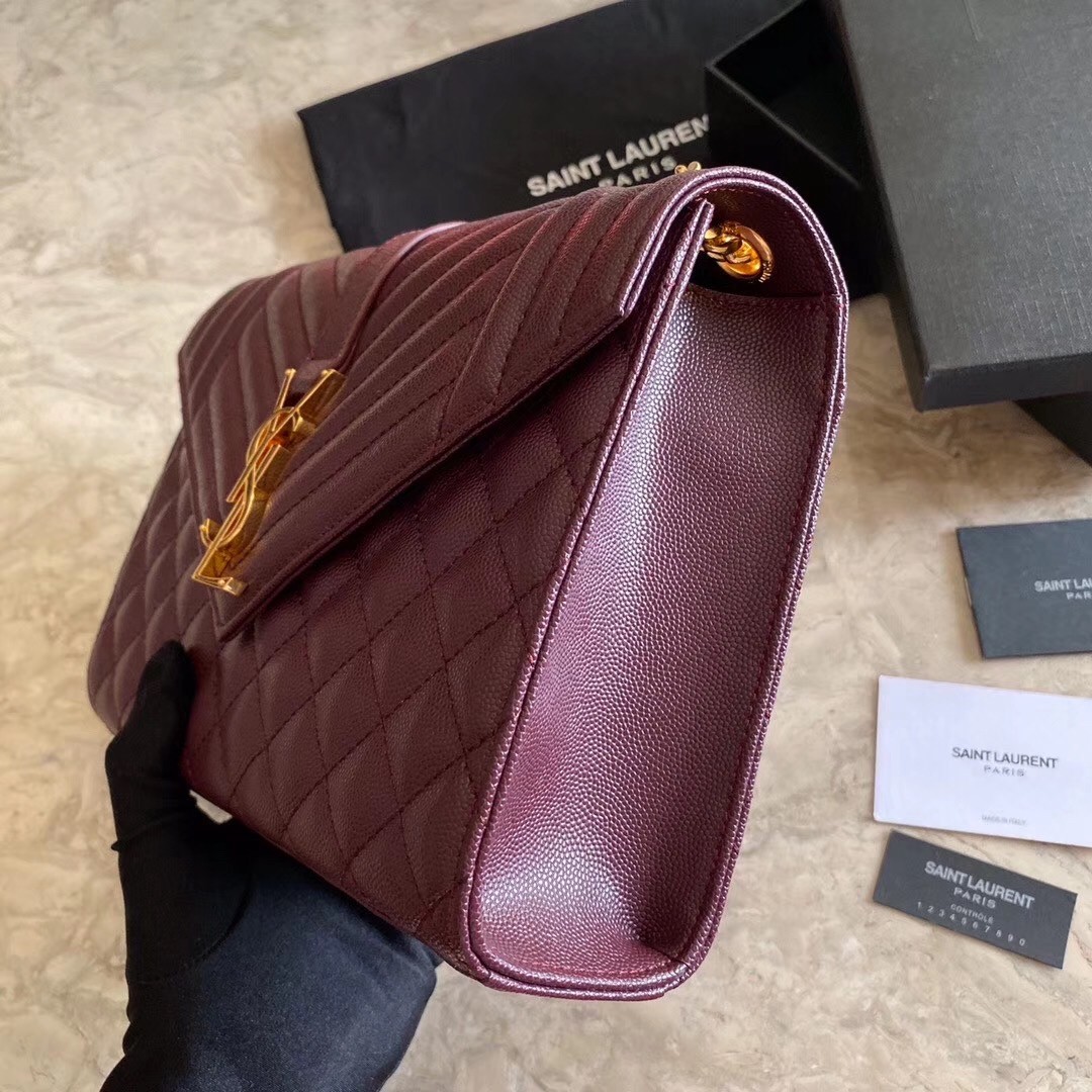 Sa**t Lau*nt medium envelope bag in bordeaux grained leather
