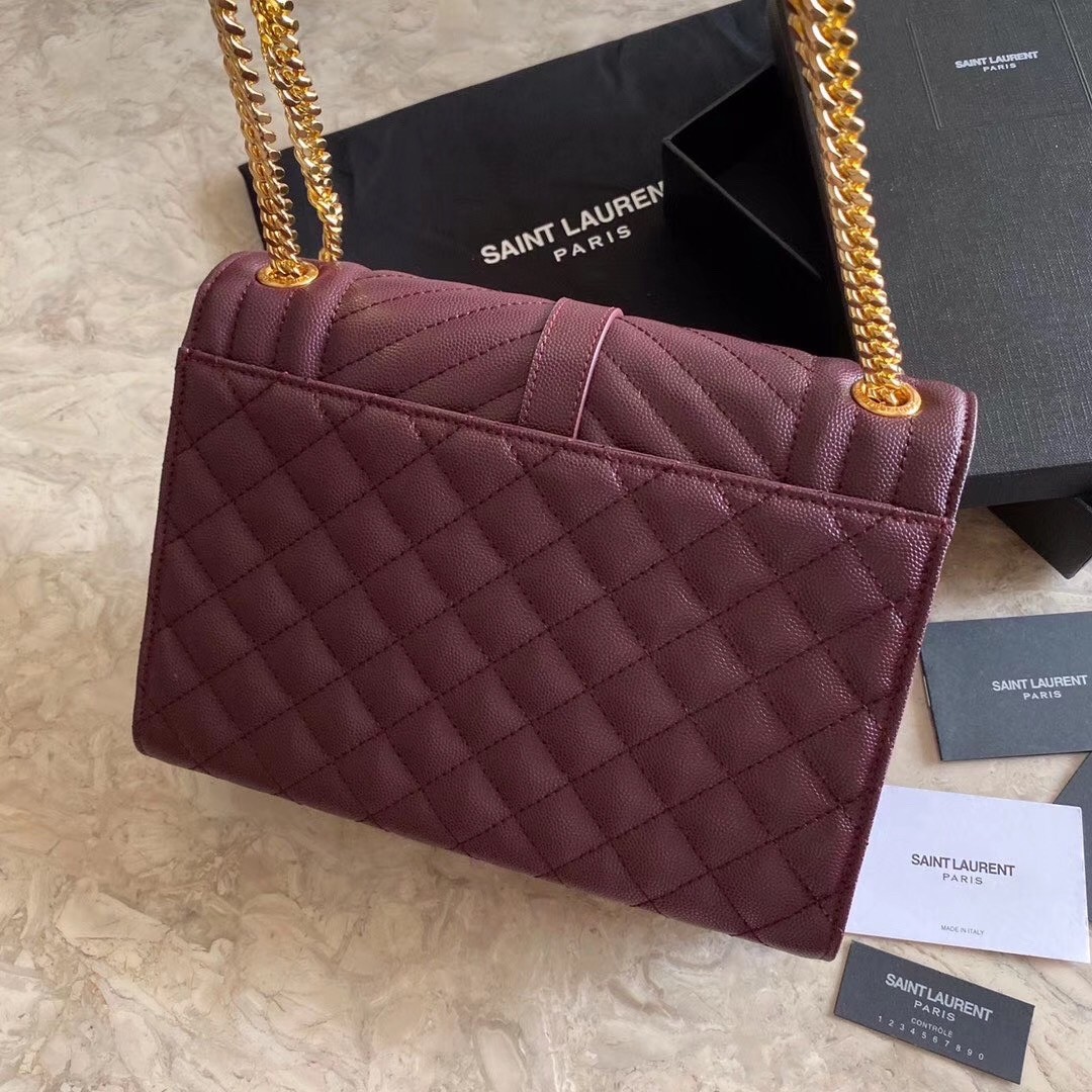 Sa**t Lau*nt medium envelope bag in bordeaux grained leather