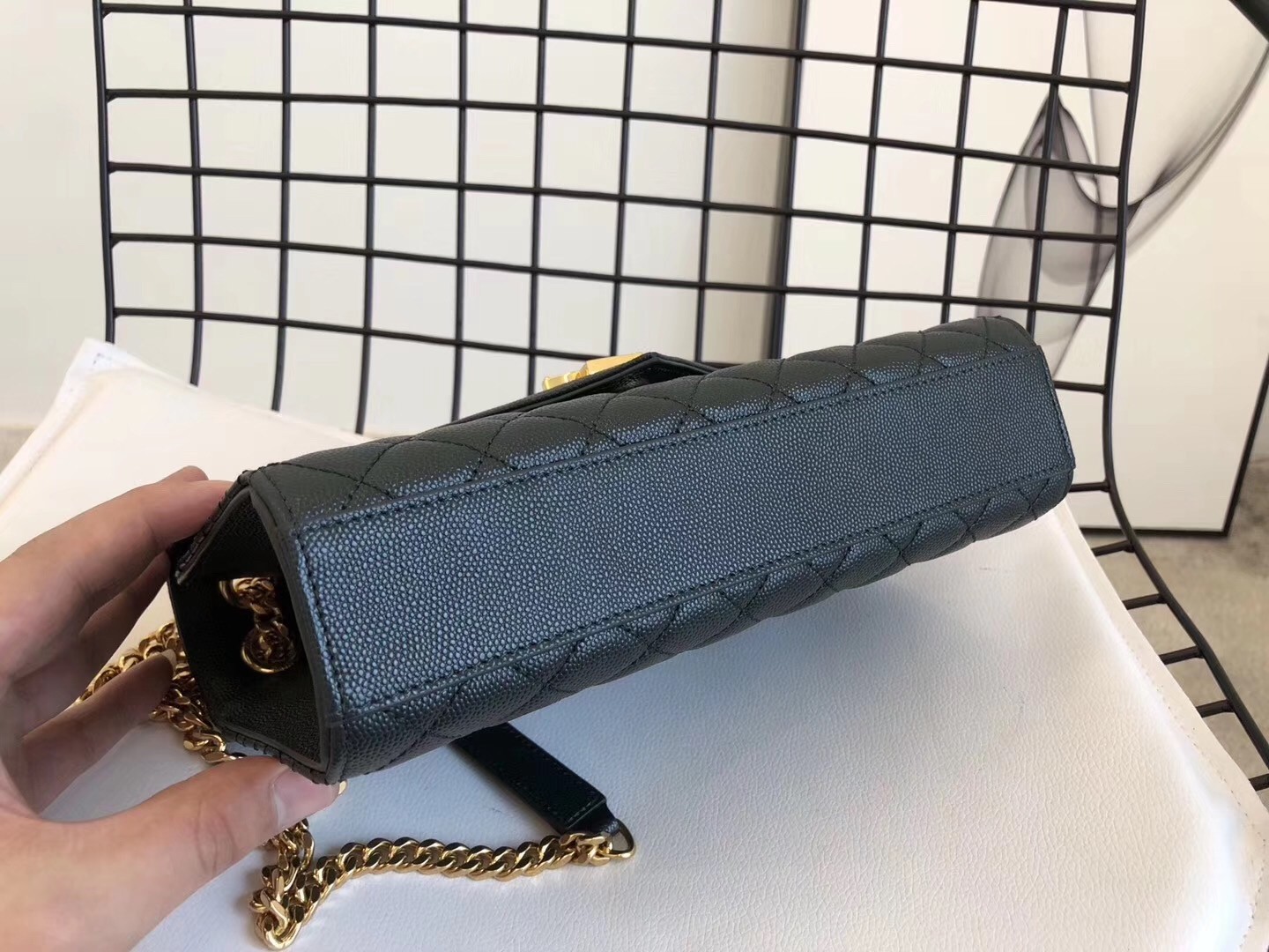 Sa**t Lau*nt medium envelope bag in dark green grained leather