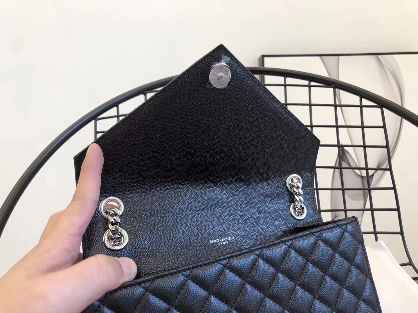 Sa**t Lau*nt medium envelope bag in noir grained leather