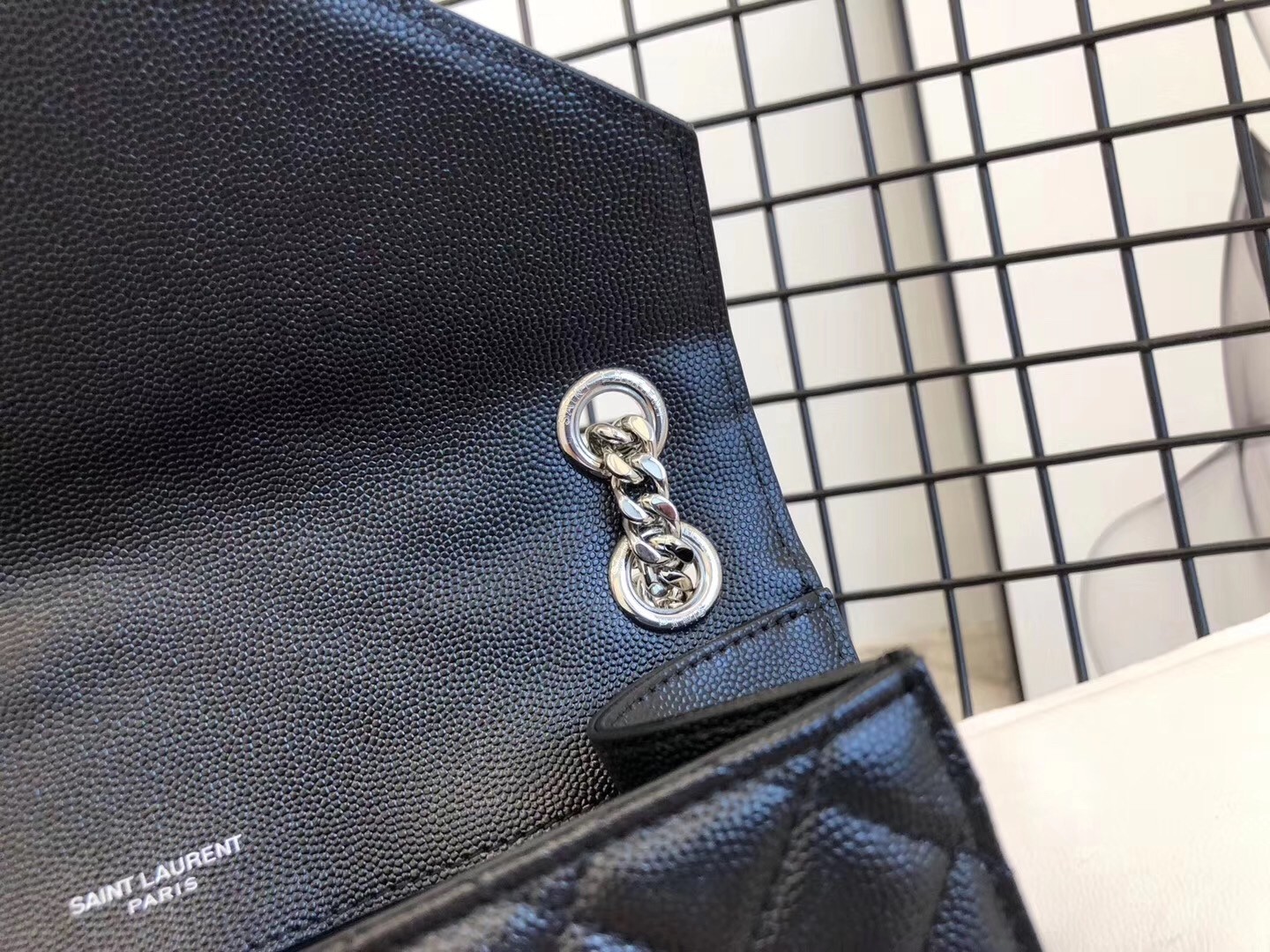 Sa**t Lau*nt medium envelope bag in noir grained leather