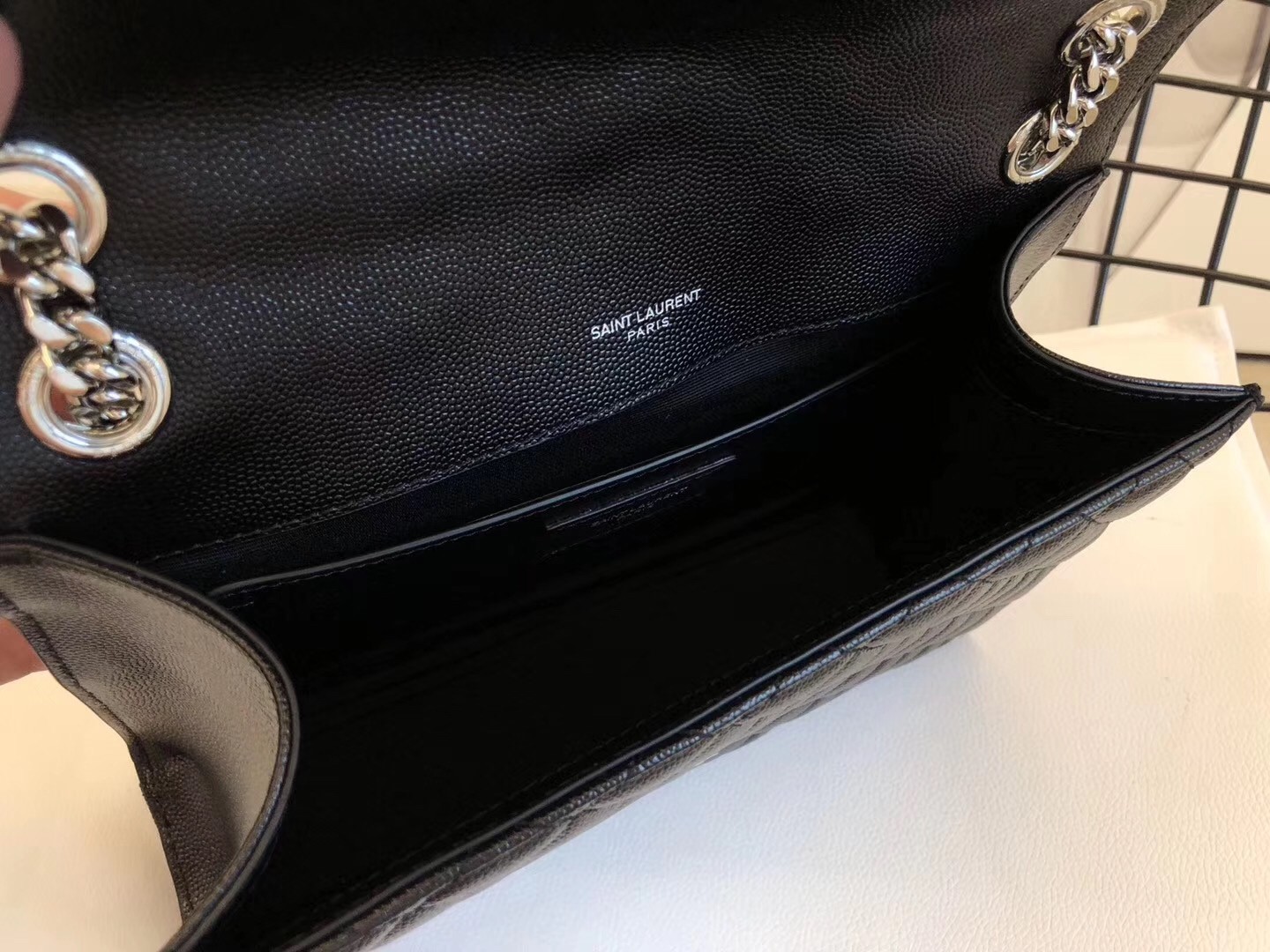 Sa**t Lau*nt medium envelope bag in noir grained leather